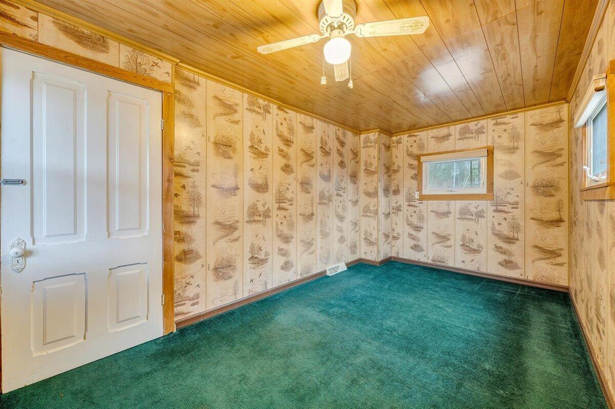 1115 Morgans Mill Road Goodview, VA 24095 - Photo 21 of 50 a view of an empty room and chandelier fan