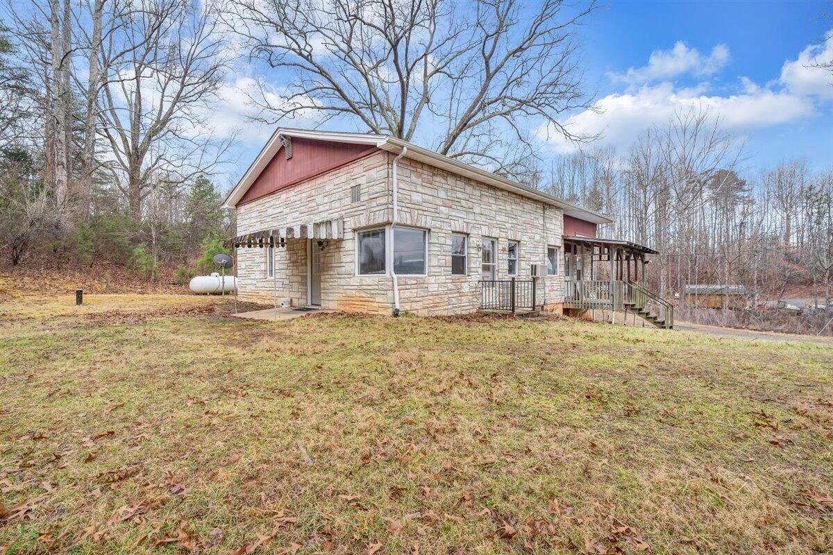 1115 Morgans Mill Road Goodview, VA 24095 - Photo 36 of 50 a view of a house with a yard and sitting area