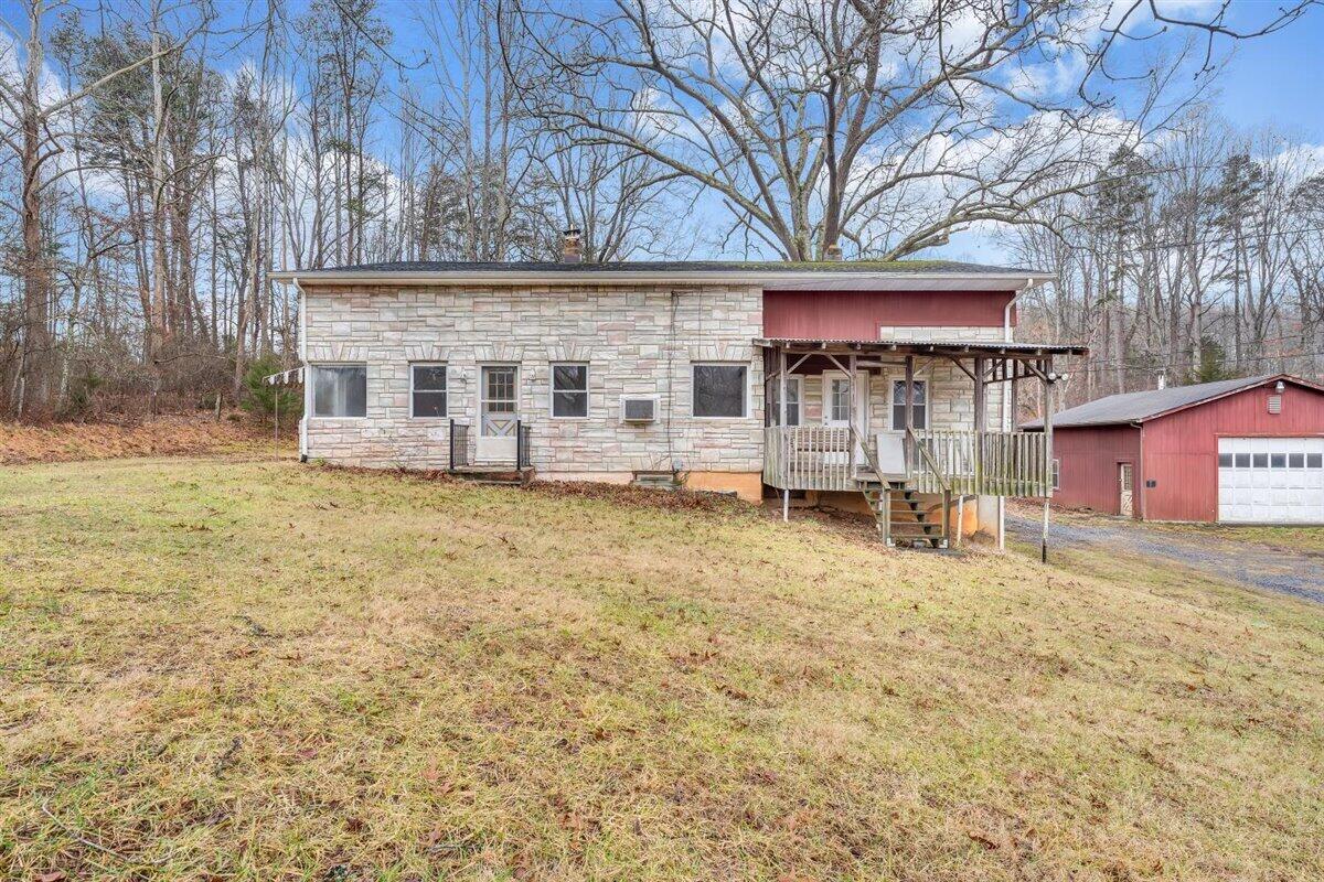 1115 Morgans Mill Road Goodview, VA 24095 - Photo 39 of 50 a view of a house with a yard and sitting area