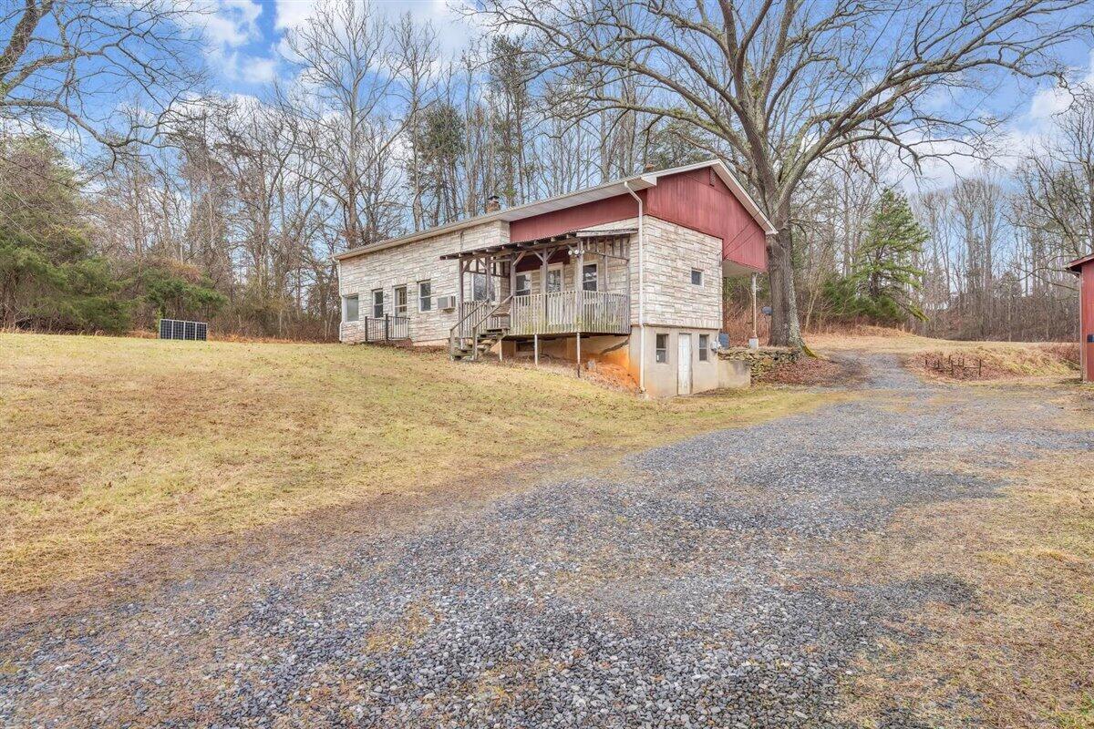 1115 Morgans Mill Road Goodview, VA 24095 - Photo 42 of 50 a view of large house with a yard covered with snow