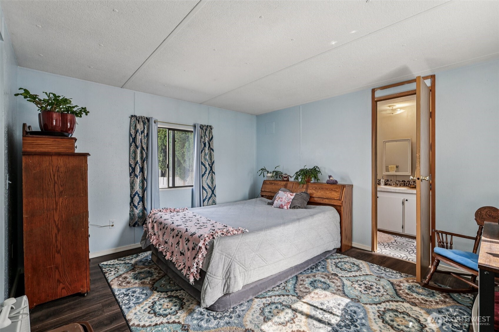 2522 Old Highway 99 South Road, Unit 19 Mount Vernon, WA 98273 - Photo 12 of 21 a bedroom with a bed and wooden floor