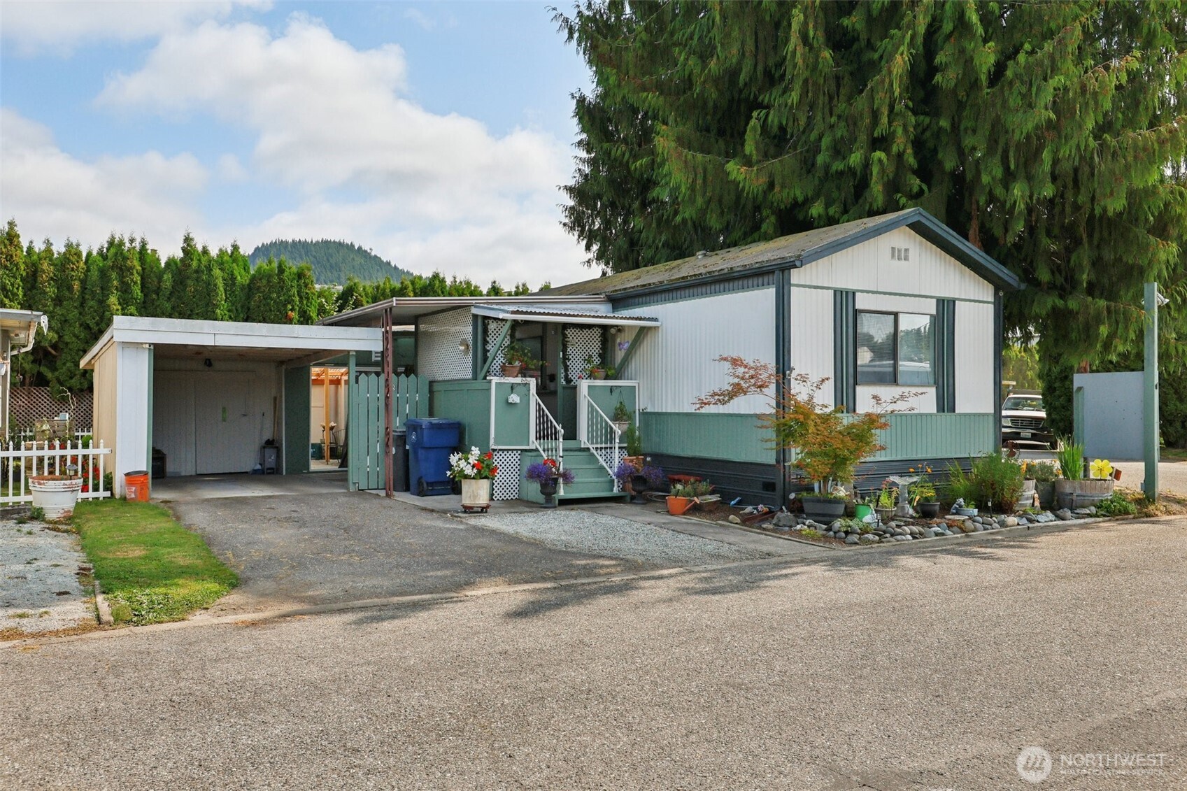 2522 Old Highway 99 South Road, Unit 19 Mount Vernon, WA 98273 - Photo 2 of 21 a view of a house with a patio and a yard