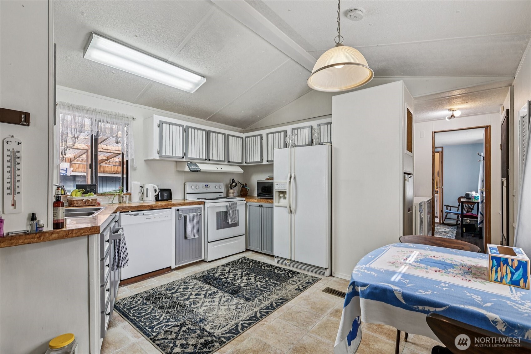 2522 Old Highway 99 South Road, Unit 19 Mount Vernon, WA 98273 - Photo 6 of 21 a kitchen with refrigerator and cabinets