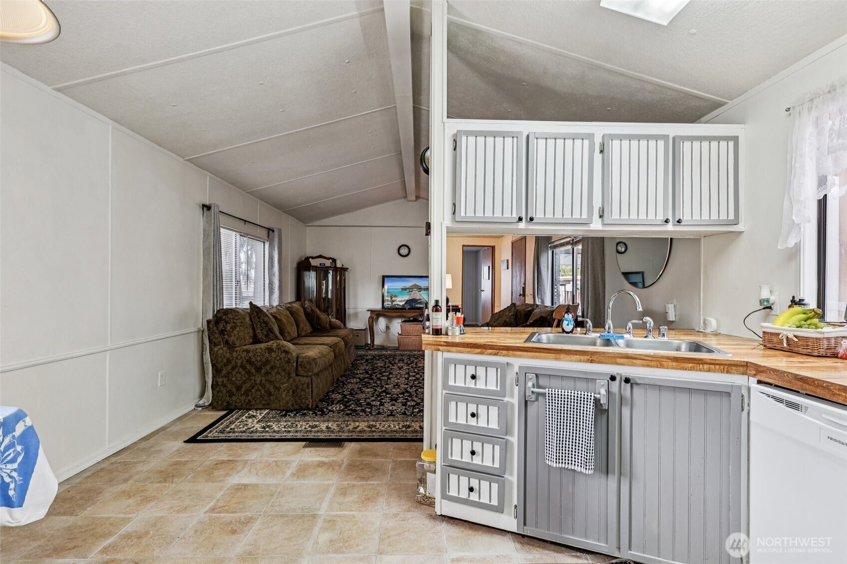 2522 Old Highway 99 South Road, Unit 19 Mount Vernon, WA 98273 - Photo 8 of 21 a living room with furniture a baby crib and a window
