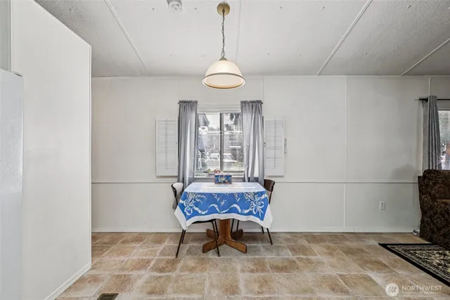 a view of a room with furniture and windows