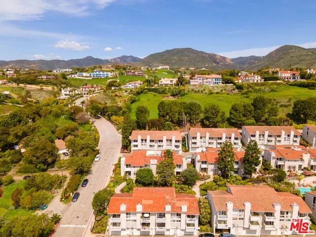 a view of a city with mountains in the background