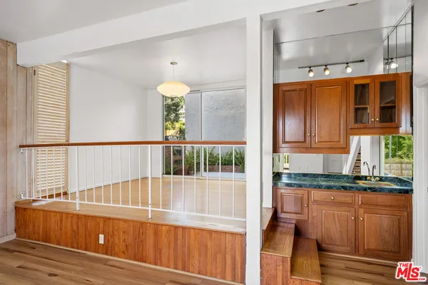 a view of a balcony with chairs
