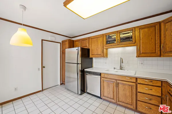a bathroom with a double vanity sink mirror and shower