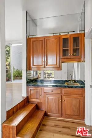a view of a room with wooden floor and window