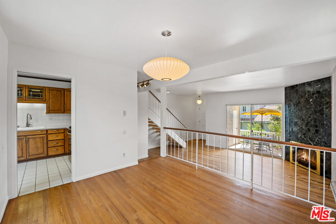 28288 Rey De Copas Lane Malibu, CA 90265 - Photo 31 of 44 a view of a room with wooden floor and windows