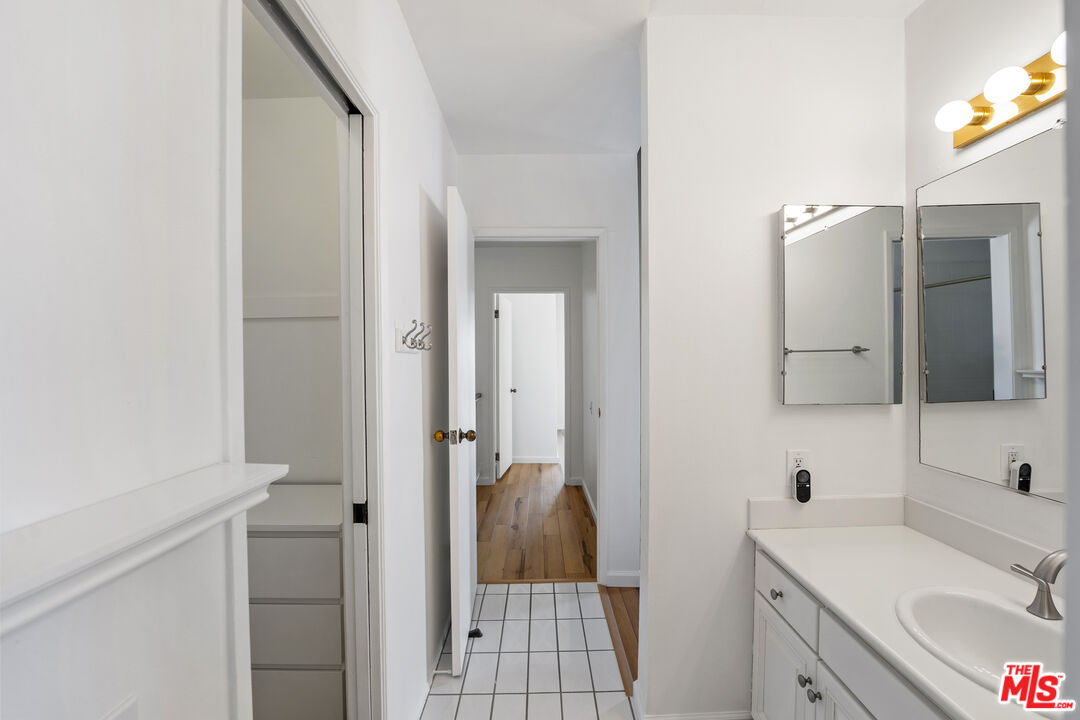 28288 Rey De Copas Lane Malibu, CA 90265 - Photo 38 of 44 a bathroom with a sink and a mirror