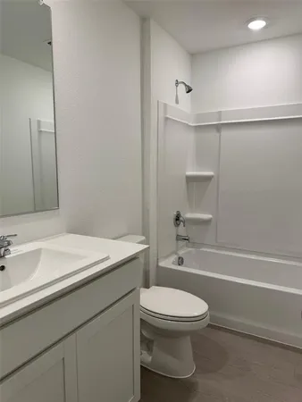 a bathroom with a toilet a sink and a bathtub