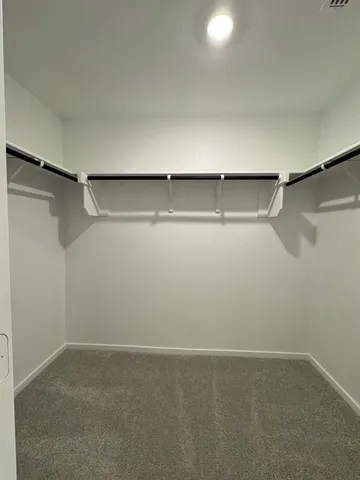 a view of an empty walk in closet