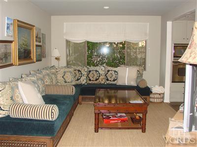2101 Peninsula Road Oxnard, CA 93035 - Photo 14 of 28 a living room with furniture and a floor to ceiling window
