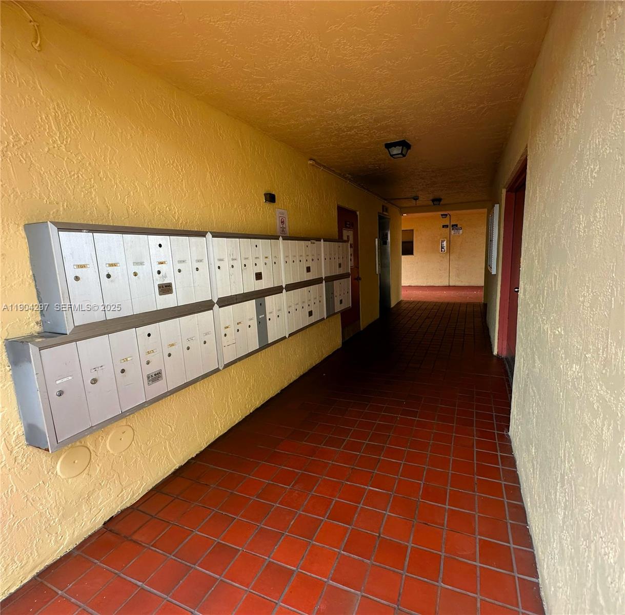 3396 Foxcroft Road, Unit 305 Miramar, FL 33025 - Photo 20 of 20 a view of a hallway