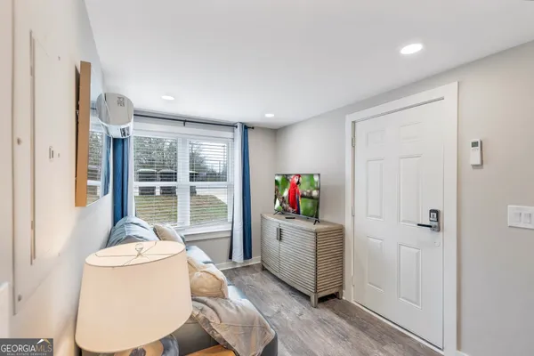 a living room with furniture and a large window