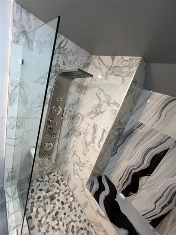 an empty room with wooden floor and closet