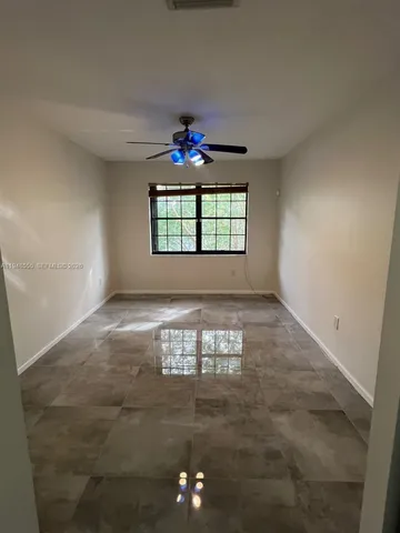 a view of a house with a garden and pathway