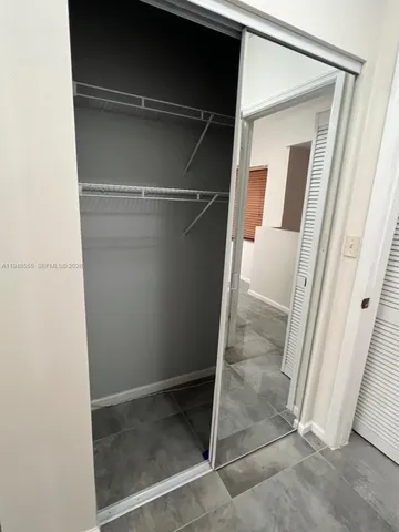 a view of a house with swimming pool and a yard