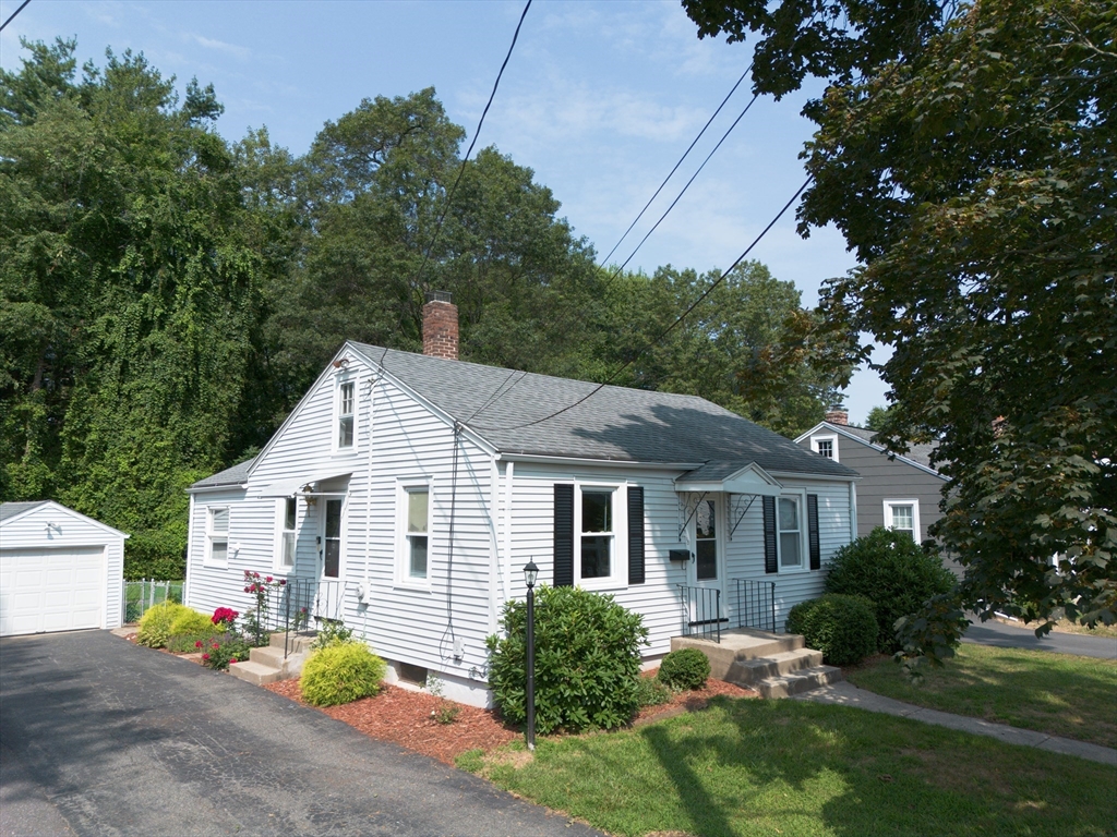 58 Gilman Street Springfield, MA 01118 - Photo 1 of 18 a front view of house with yard and green space