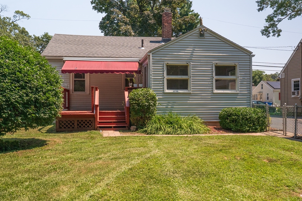 58 Gilman Street Springfield, MA 01118 - Photo 17 of 18 a view of a house with a yard and plants