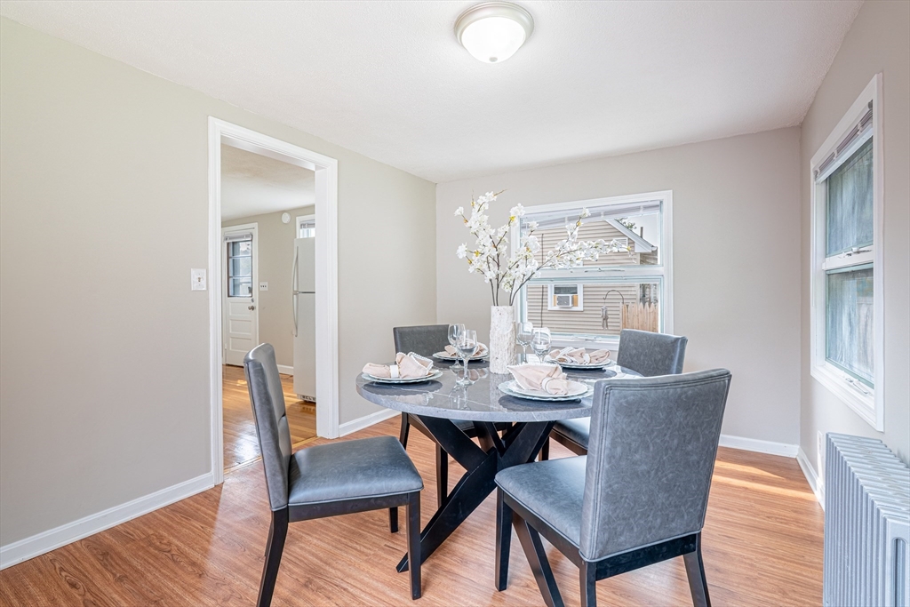 58 Gilman Street Springfield, MA 01118 - Photo 6 of 18 a view of a dining room with furniture window and wooden floor