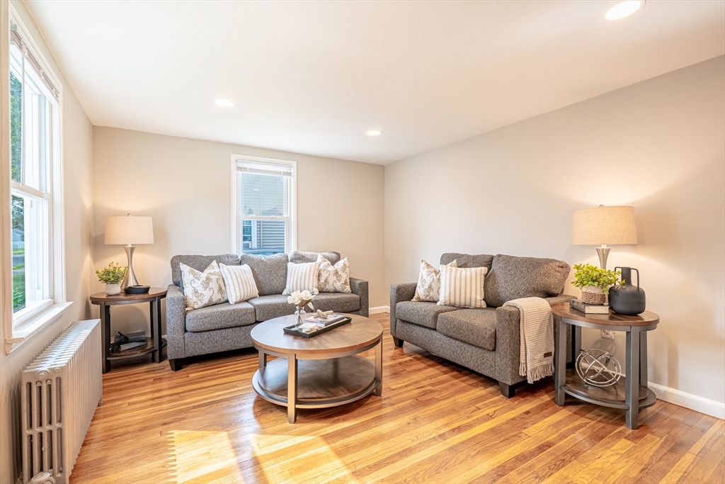 58 Gilman Street Springfield, MA 01118 - Photo 7 of 18 a living room with furniture and a large window