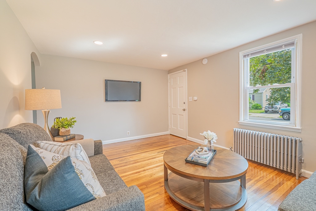 58 Gilman Street Springfield, MA 01118 - Photo 9 of 18 a living room with furniture and a window