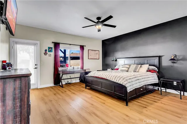 a bedroom with a bed and dresser