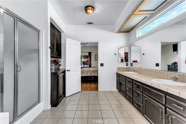 a kitchen with a sink cabinets and appliances
