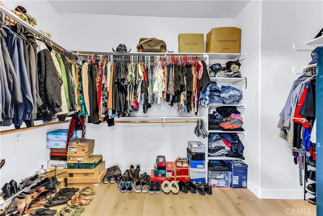 a view of a living room and a livingroom with furniture wooden floor