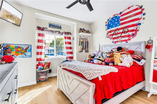 a bed room with a bed and a chair