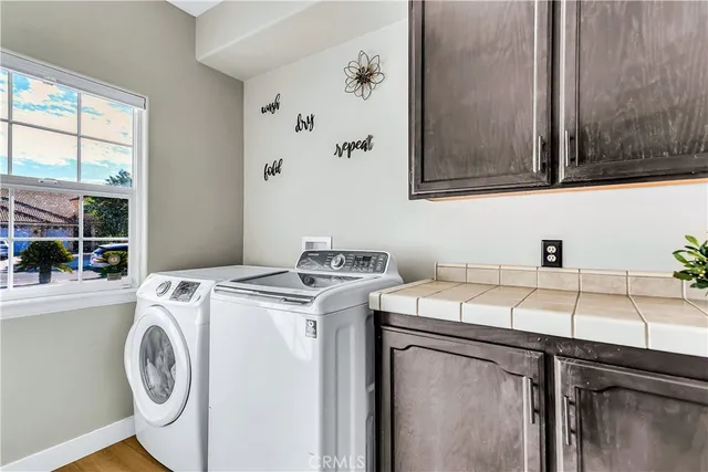 a bathroom with a granite countertop toilet sink and mirror