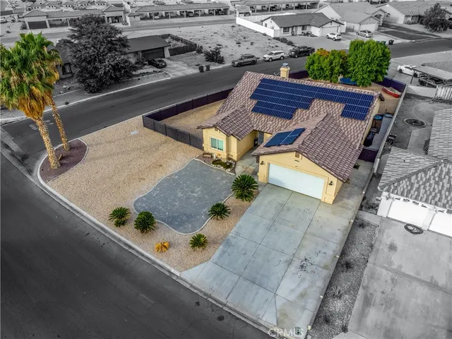 an aerial view of residential house with outdoor space