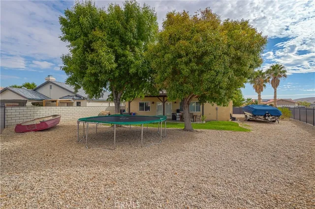 a view of a backyard with a table and chair