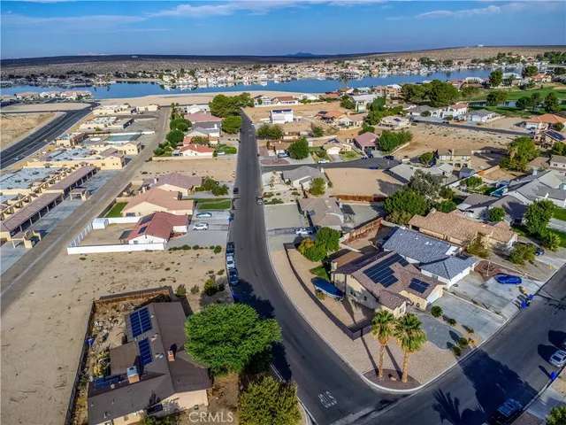 a view of a patio with table and chairs and potted plants