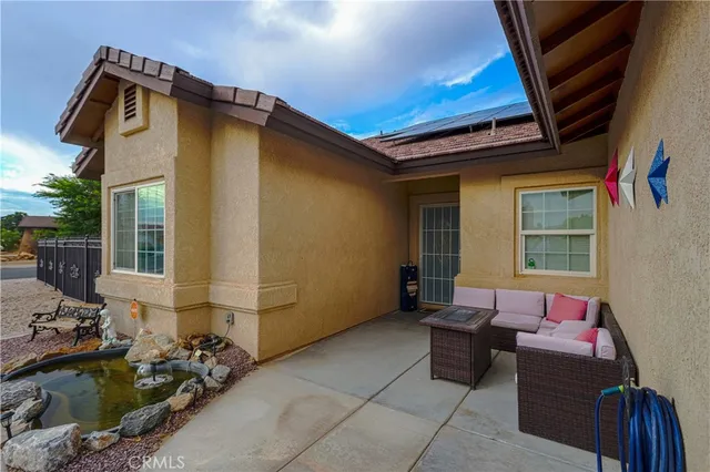 a living room with dining room and wooden floor