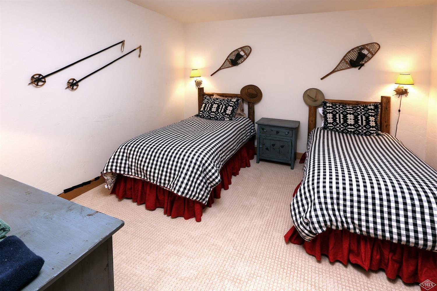 24 Clubhouse Circle Edwards, CO 81632 - Photo 11 of 17 a bedroom with bed and wooden floor