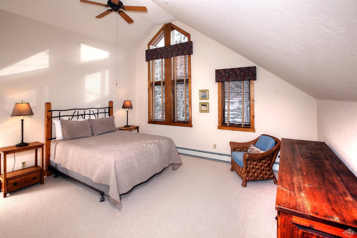 24 Clubhouse Circle Edwards, CO 81632 - Photo 7 of 17 a spacious bedroom with a bed and window