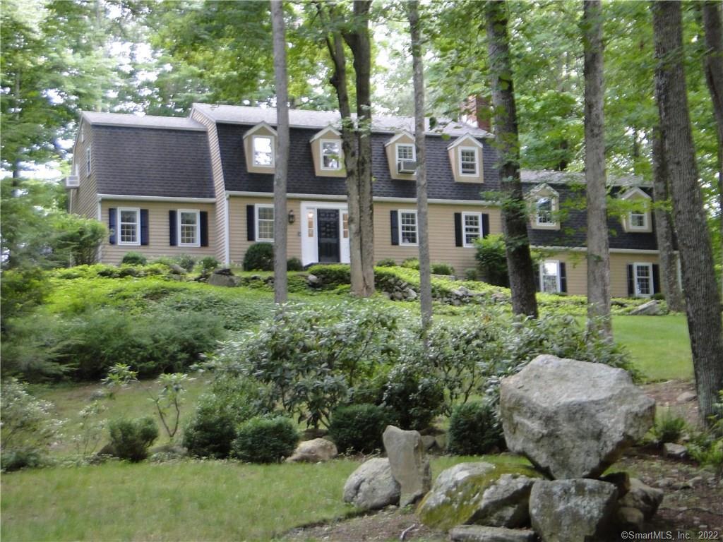 207 Limestone Road Ridgefield, CT 06877 - Photo 1 of 1 a front view of a house with garden