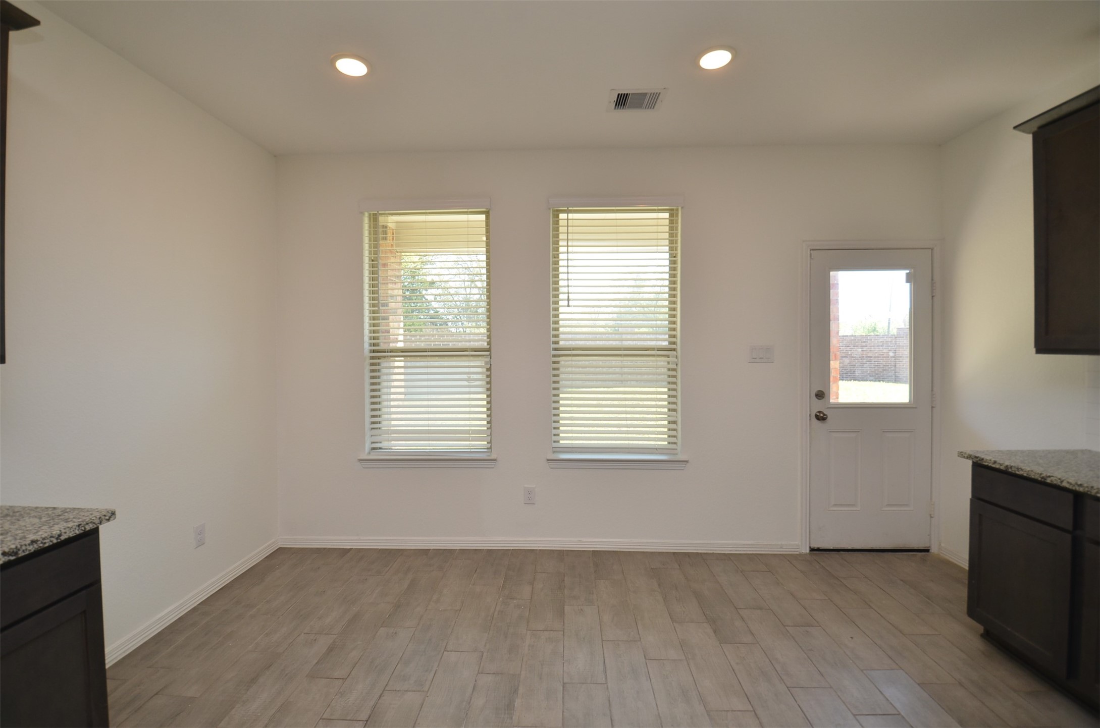 5602 Tabula Rasa Drive Katy, TX 77493 - Photo 11 of 38 an empty room with wooden floor and windows