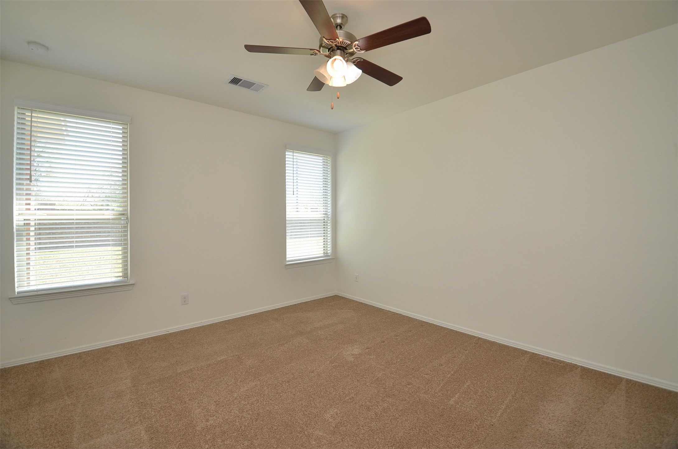 5602 Tabula Rasa Drive Katy, TX 77493 - Photo 12 of 38 an empty room with a window and a fan