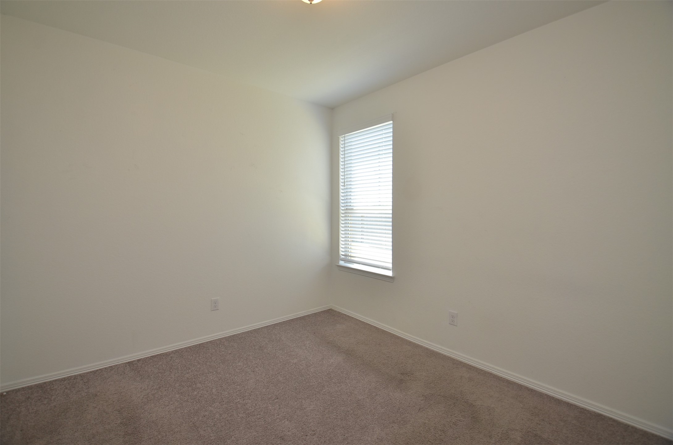 5602 Tabula Rasa Drive Katy, TX 77493 - Photo 16 of 38 an empty room with a window