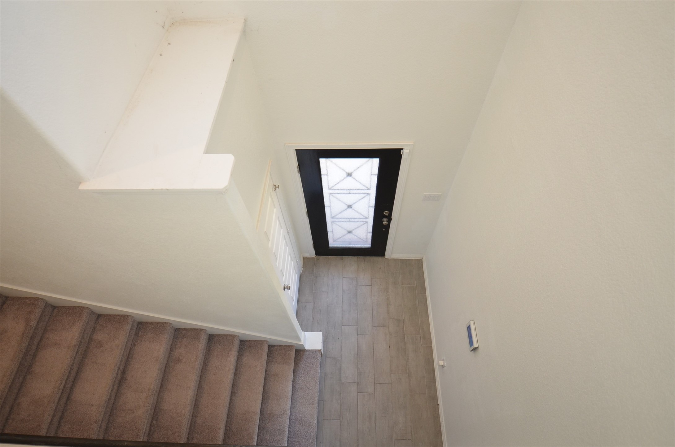 5602 Tabula Rasa Drive Katy, TX 77493 - Photo 17 of 38 a view of a hallway with wooden floor and a window