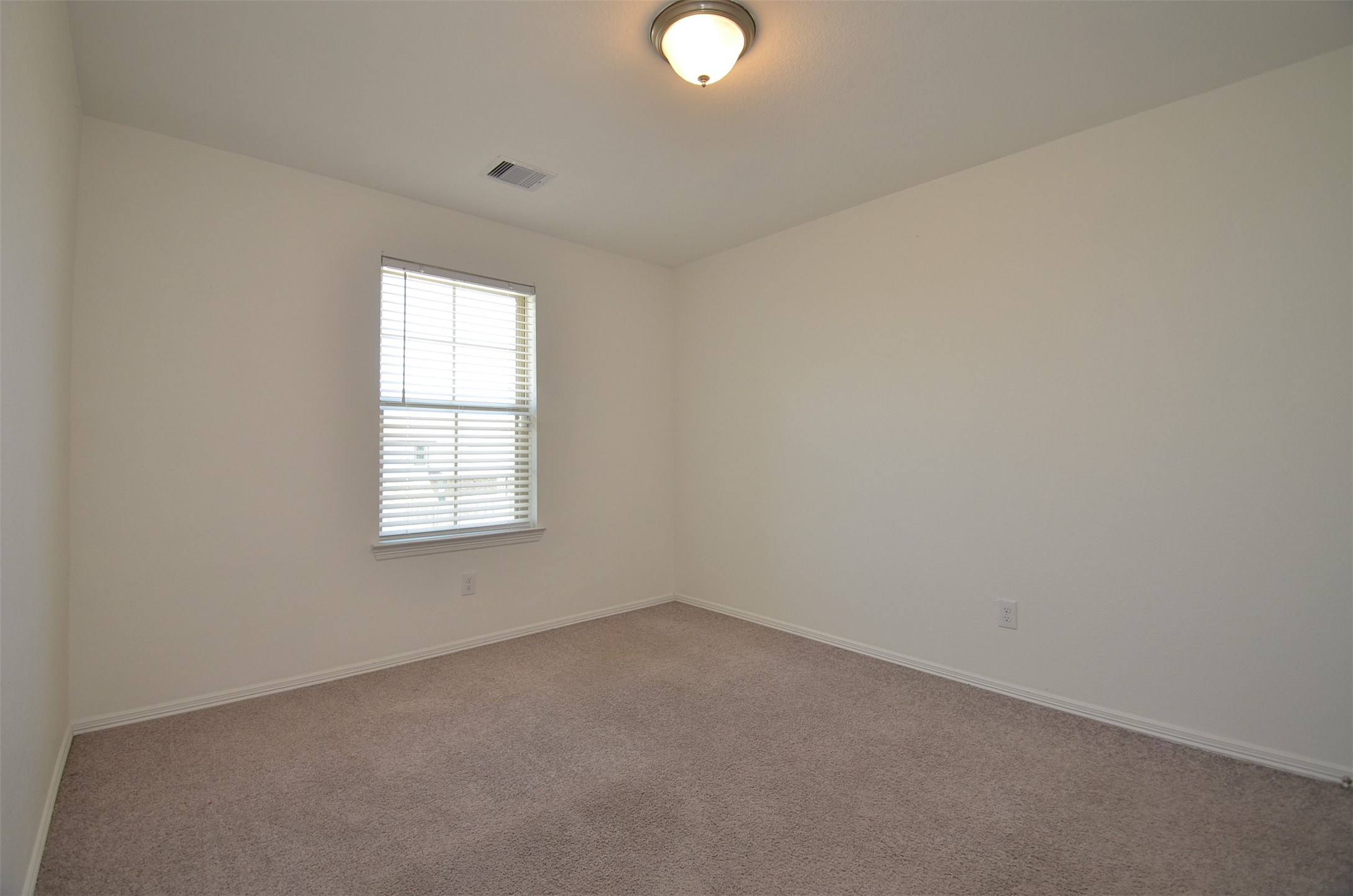 5602 Tabula Rasa Drive Katy, TX 77493 - Photo 23 of 38 an empty room with a window