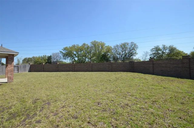 a view of patio and yard