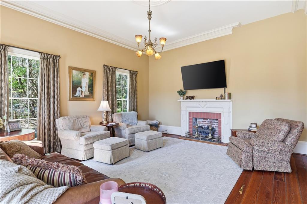 8075 Lakeview Road Statesboro, GA 30461 - Photo 12 of 46 a living room with furniture fireplace and flat screen tv