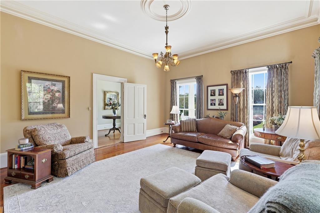 8075 Lakeview Road Statesboro, GA 30461 - Photo 13 of 46 a living room with furniture ceiling fan and a window