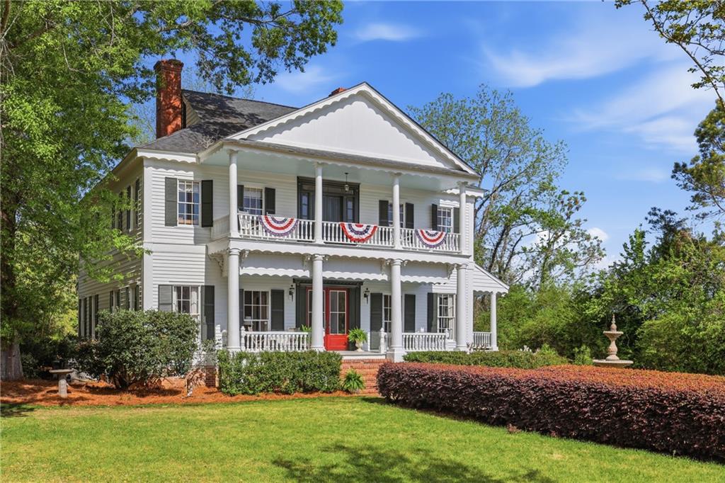8075 Lakeview Road Statesboro, GA 30461 - Photo 2 of 46 a front view of a house with a yard