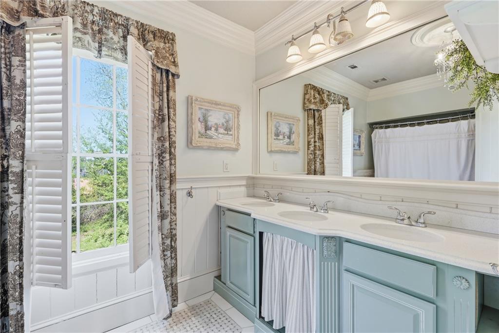 8075 Lakeview Road Statesboro, GA 30461 - Photo 31 of 46 a bathroom with a granite countertop sink mirror and a shower